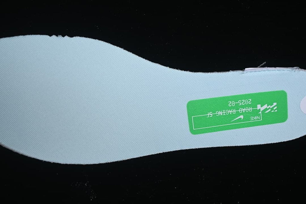 Close-up of the pale blue shoe insole and printed label