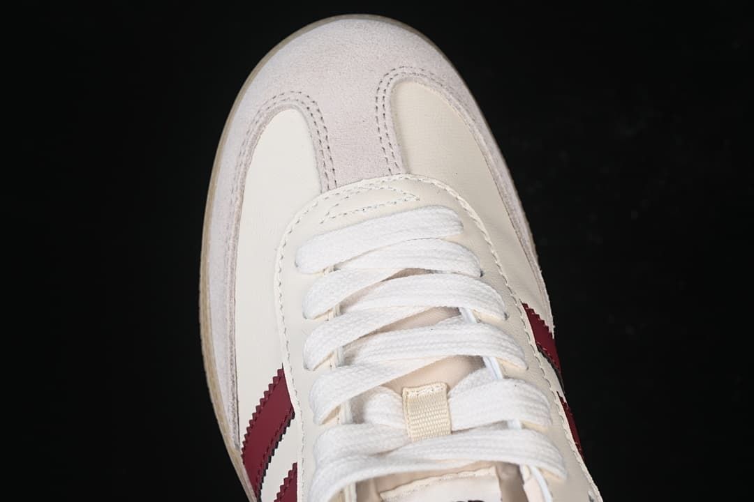 Top-down close-up of the toe, suede-look overlays, and white laces.