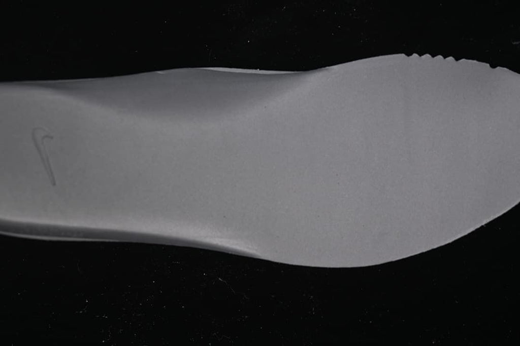 Close-up view of a light grey shoe insert