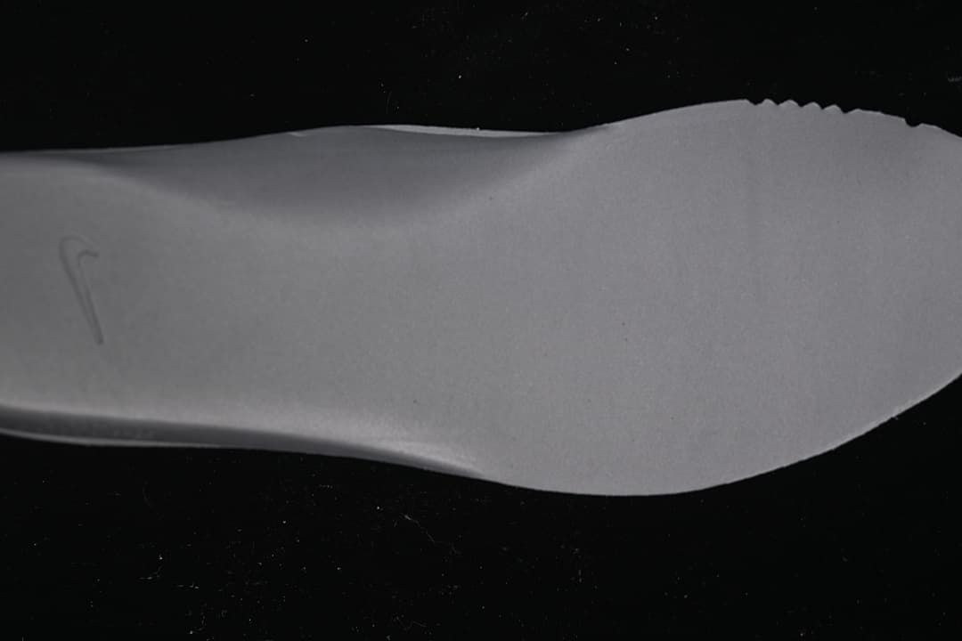 Close-up view of a light grey shoe insert