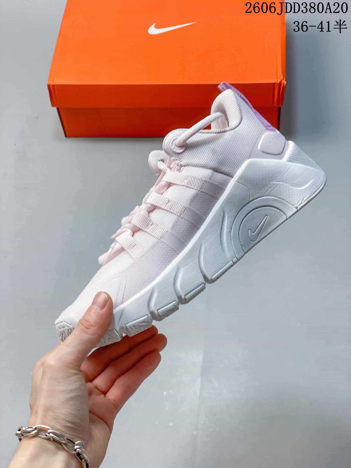 Side view of the white Nike Free Metcon 7 training shoe with purple accents