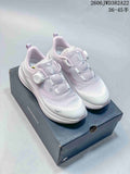 White and pale lavender DESCENTE running sneakers with BOA dial closure, shown on a shoe box