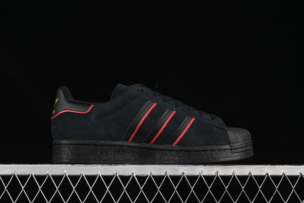 Side profile showing red stripes and a black sole