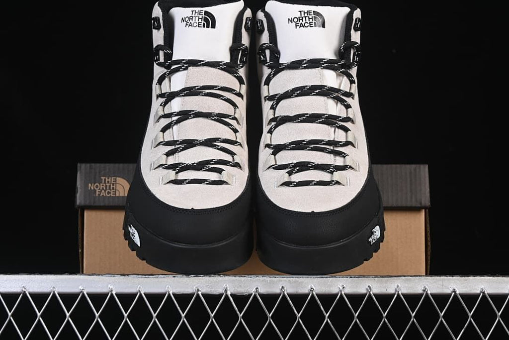 Front view of the pair of boots displayed on the shoe box
