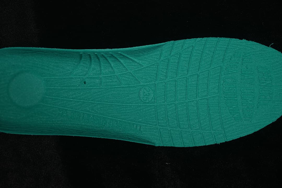 Close-up of the teal-colored outsole of the MLB sneaker