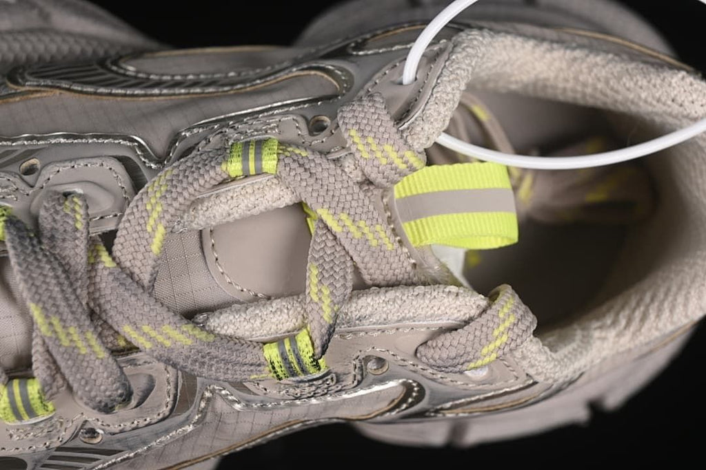 Close-up of the lace-up area and fluorescent yellow details