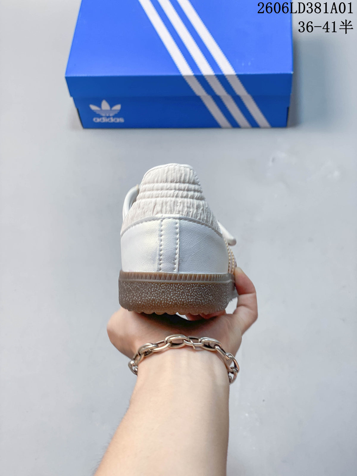 Rear view of the sneaker with a white heel and gum-colored sole