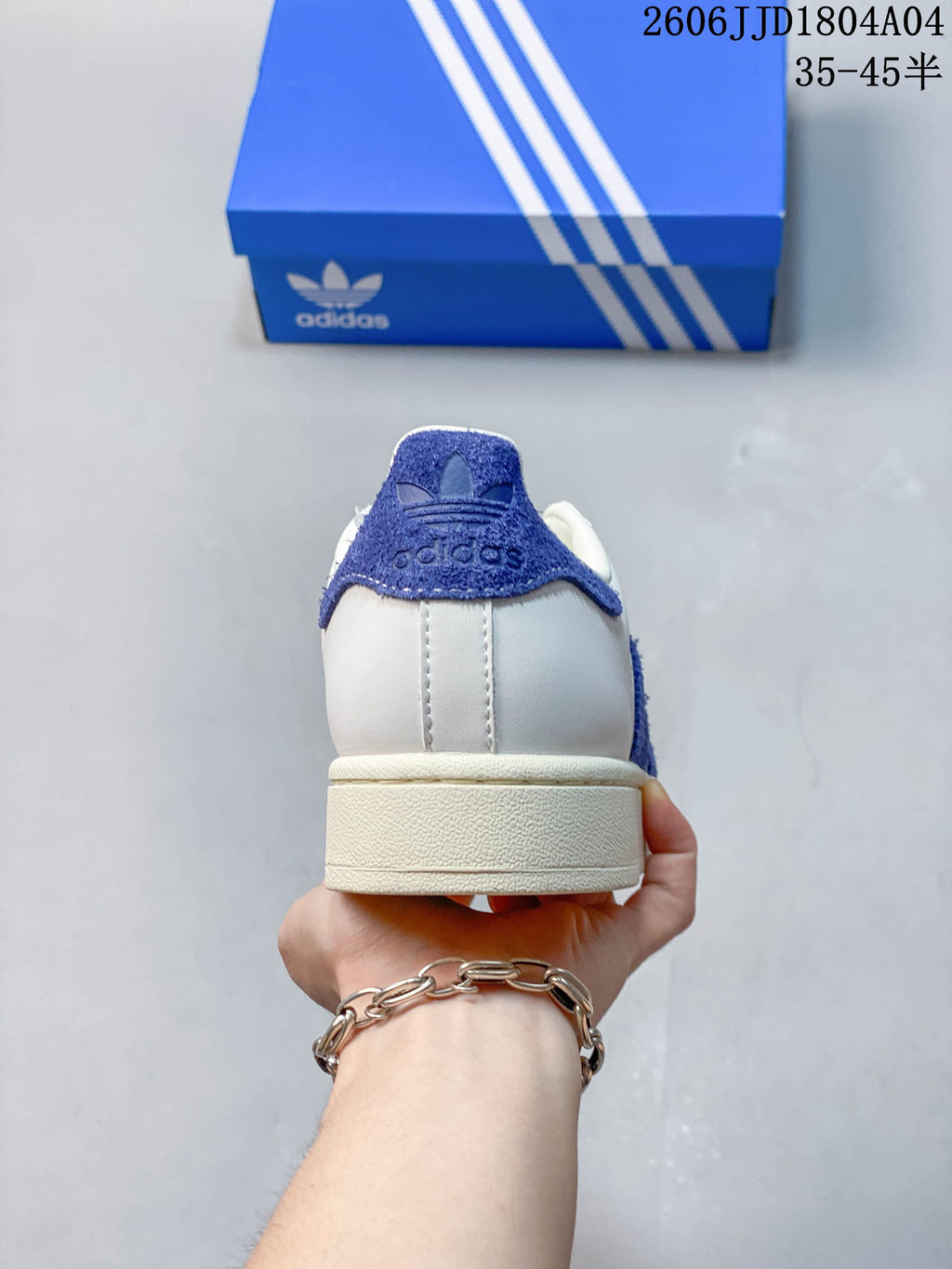Rear view of the sneaker with a blue heel accent