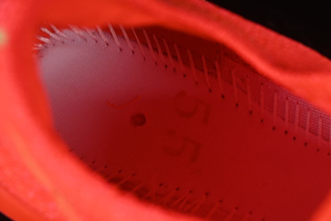 Close-up inside the bright crimson running shoe