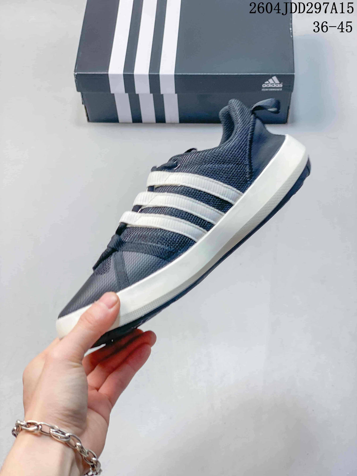 Side profile of the adidas Terrex CC Boat showing mesh-style upper and white stripes