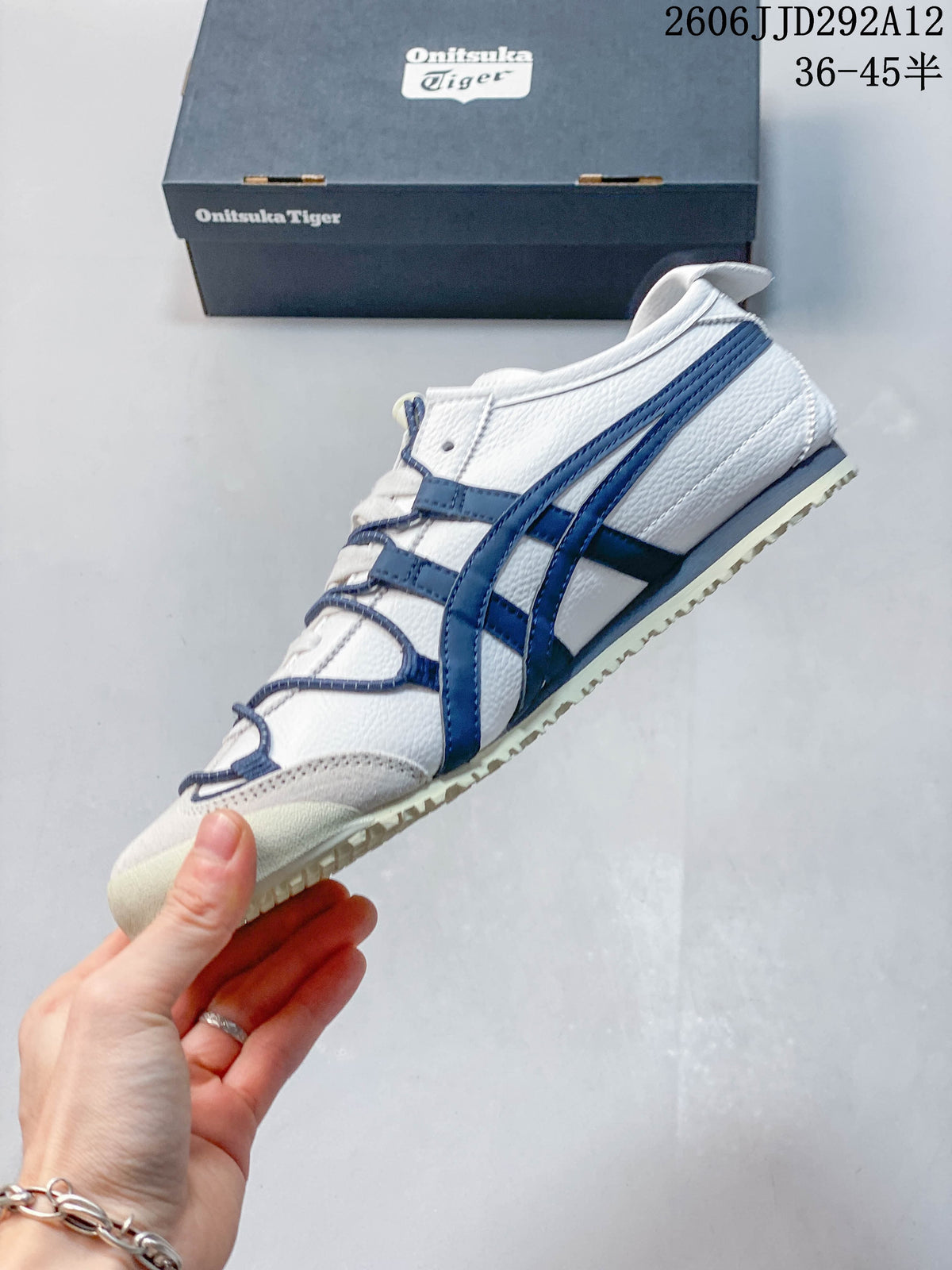 Side profile of the white sneaker with navy Onitsuka Tiger stripes and a cream-colored outsole.