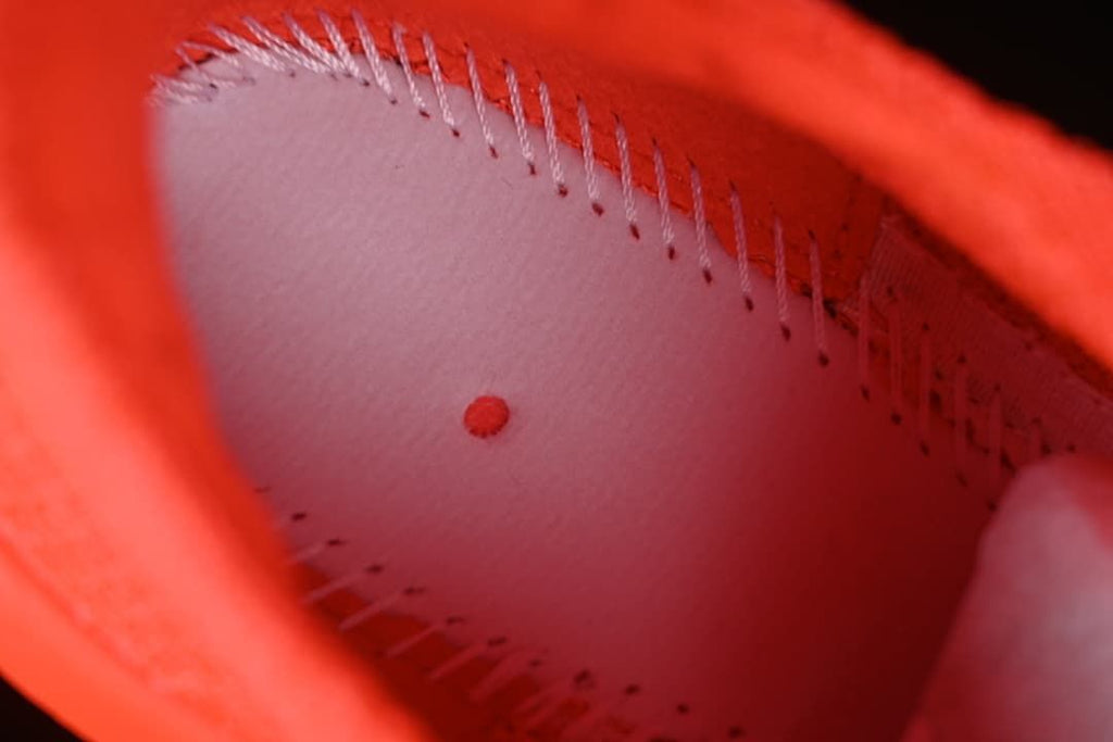 Close-up view inside the bright-crimson shoe.