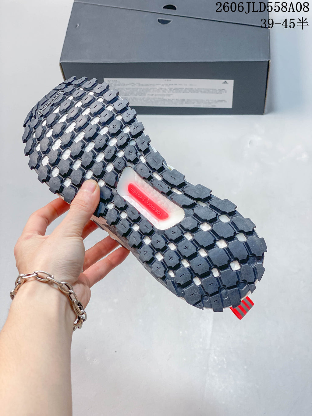Close-up of the lugged outsole with a visible Torsion System insert.