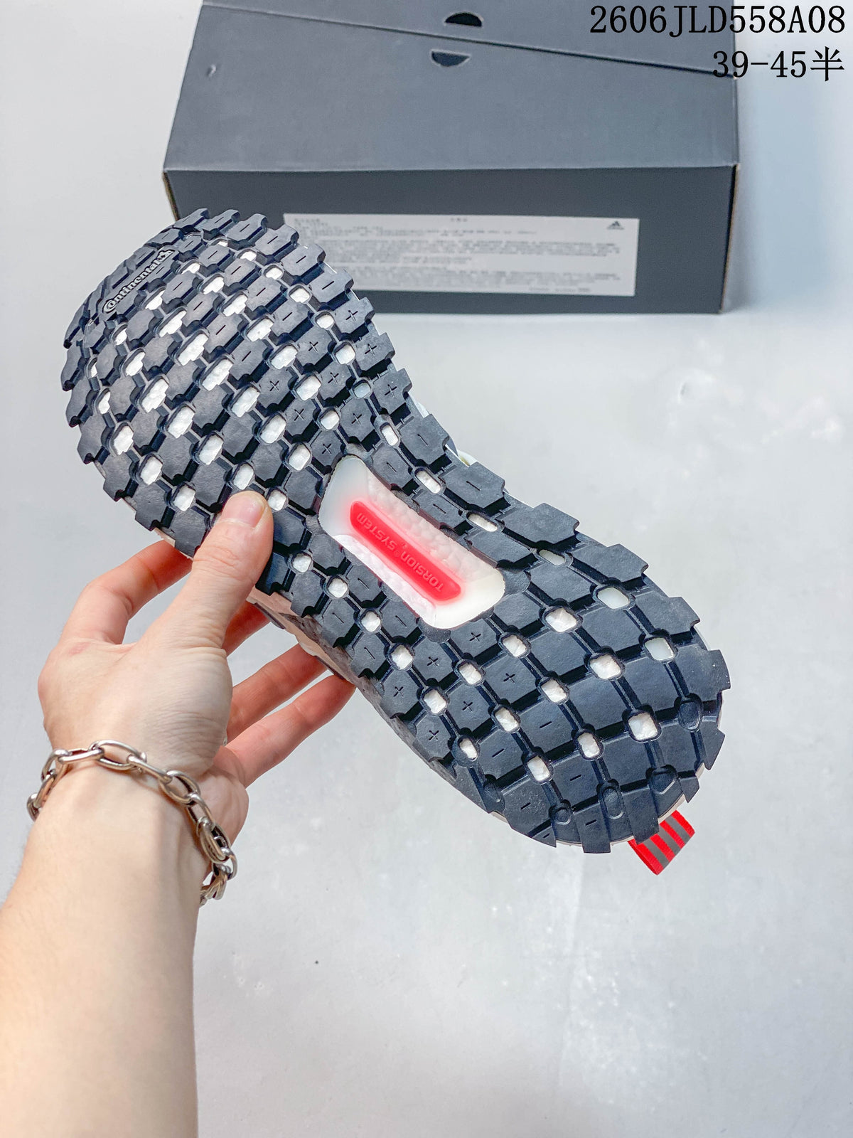 Close-up of the lugged outsole with a visible Torsion System insert.
