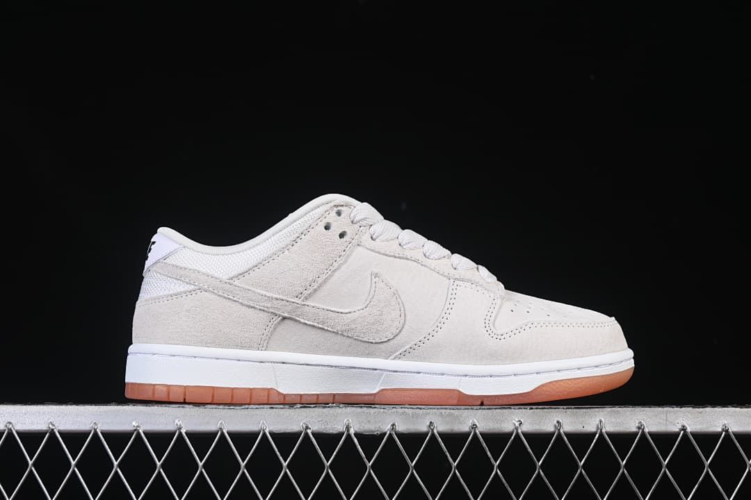 Side profile of the low-top sneaker with a matching Swoosh and gum outsole