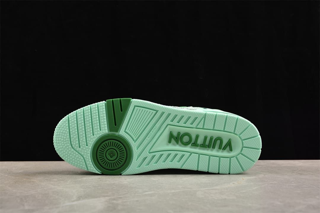 Outsole view showing the mint-green tread and decorative lettering.