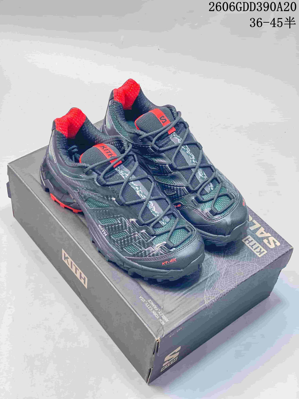 Pair of dark navy and teal Salomon XT-4K trail shoes with red accents on a Kith-branded box; image overlay shows EU sizes 36–45.5.