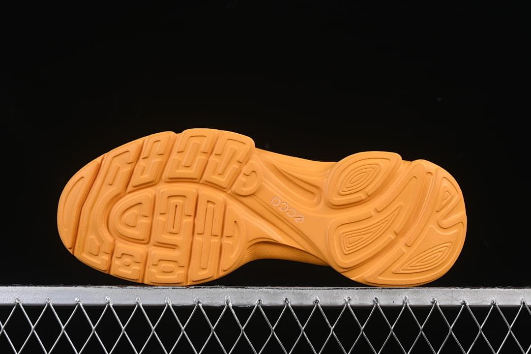 Underside view showing the amber tread pattern