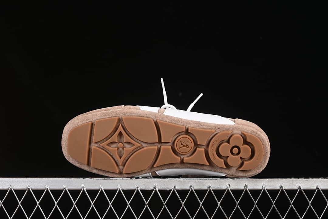 Brown outsole with patterned tread and decorative motifs