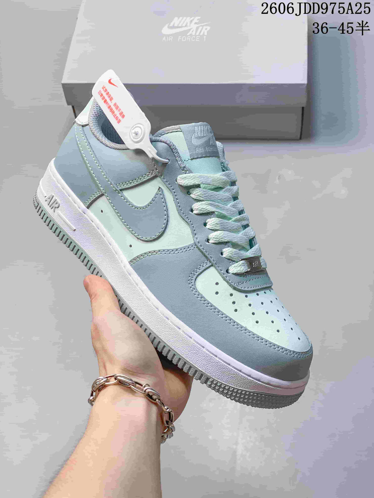 Light blue and white Nike Air Force 1 sneaker shown in close-up from the side.