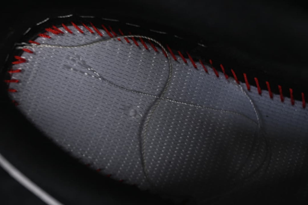 Close-up of the dark perforated interior lining