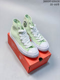Pair of pale mint green Converse high-top sneakers with white laces and white soles