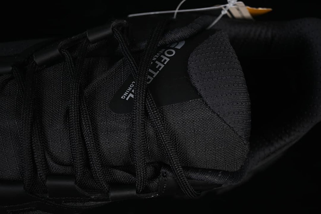Top view of black laces and tongue