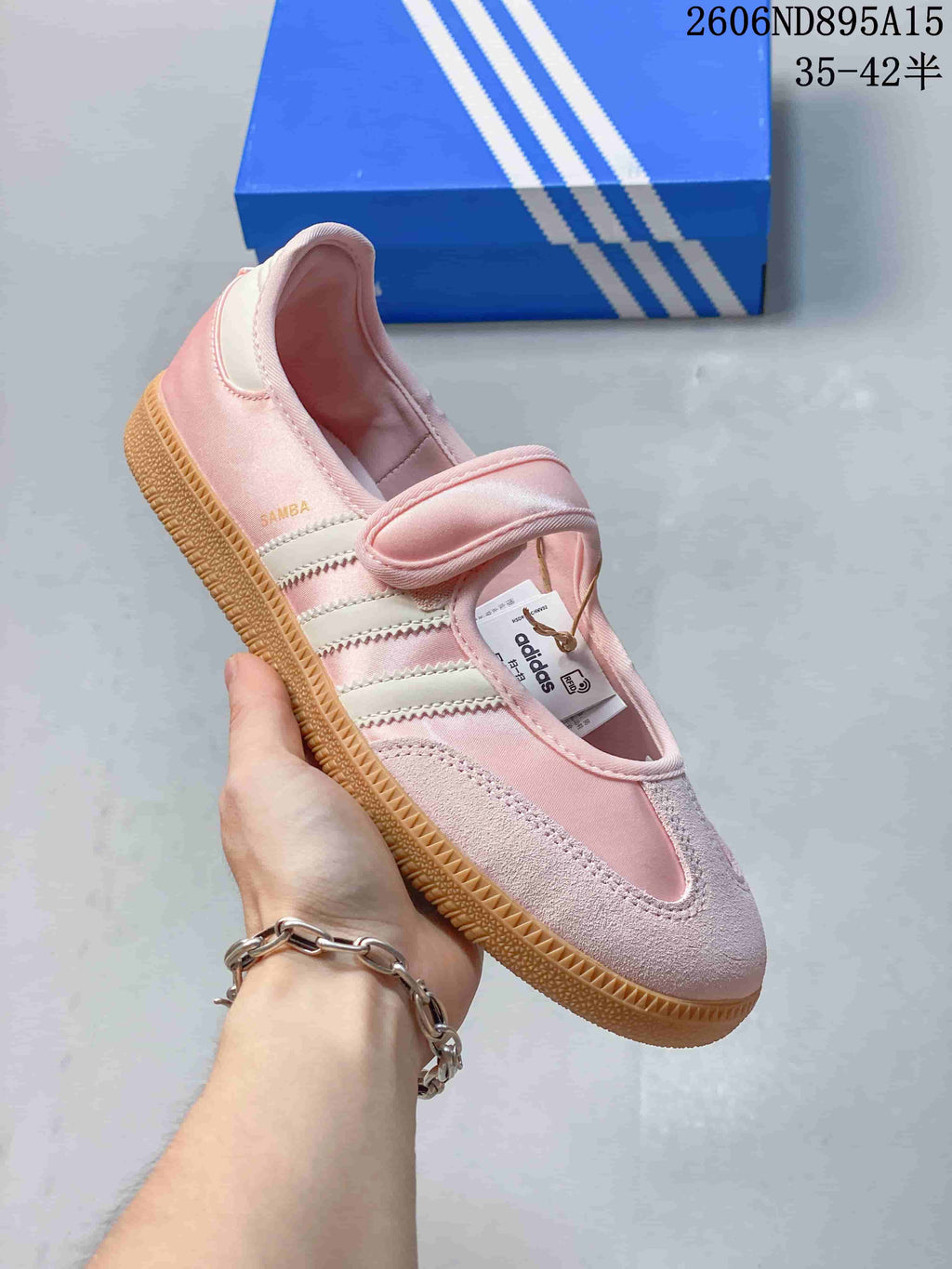 Angled view of the pink Samba Jane sneaker with its strap and side stripes