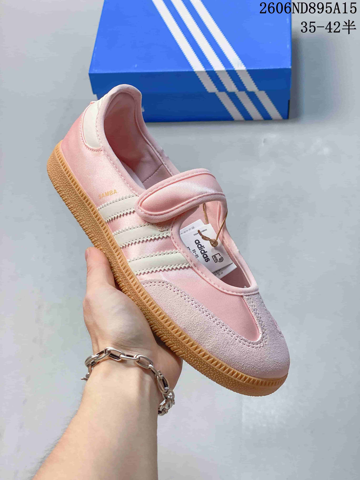 Angled view of the pink Samba Jane sneaker with its strap and side stripes