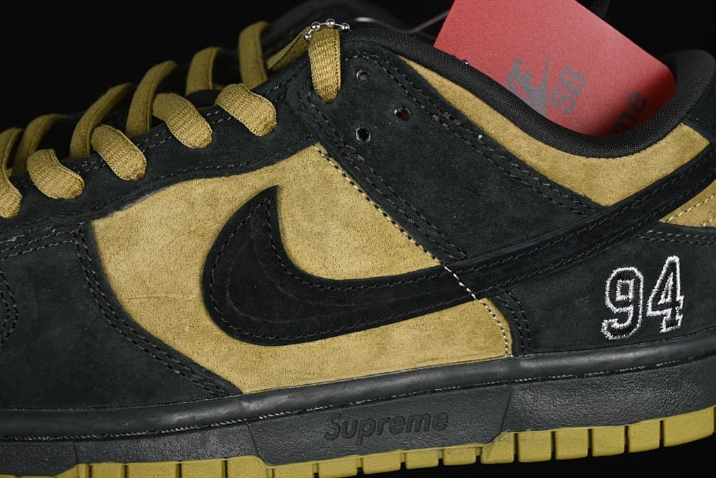 Close-up of side Swoosh, 94 heel graphic, and midsole lettering