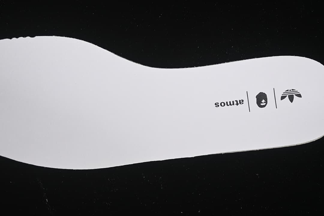 Insole printed with adidas, BAPE, and atmos branding