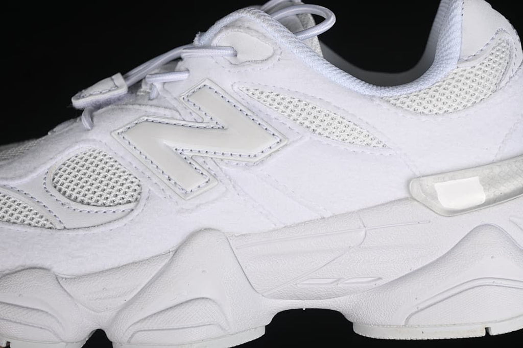 Side detail showing the New Balance logo, mesh panels, and sole.