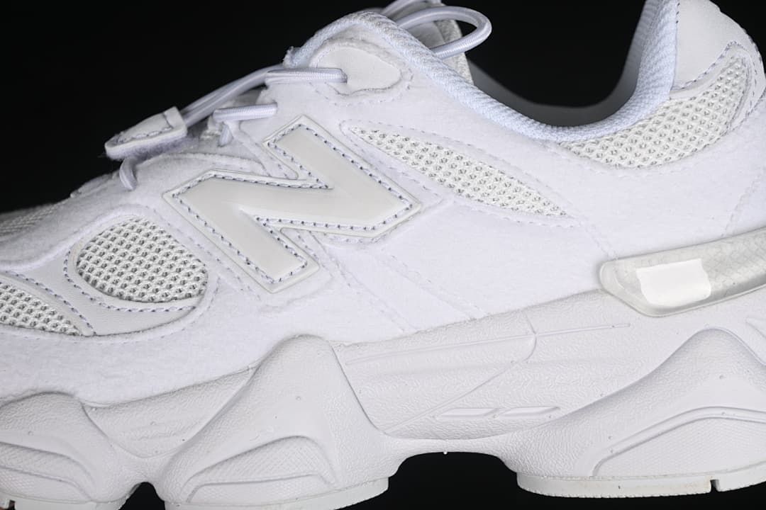 Side detail showing the New Balance logo, mesh panels, and sole.