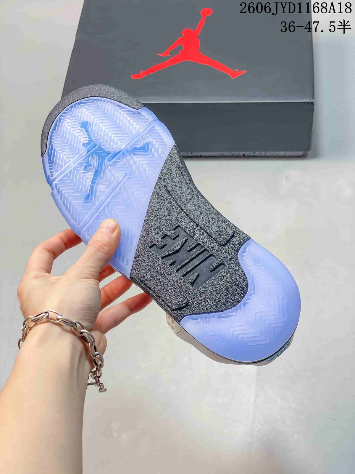Outsole view showing blue translucent sections and a gray center