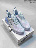 Nike Air Max Pulse shoes in white and pale blue, shown from above on a shoebox