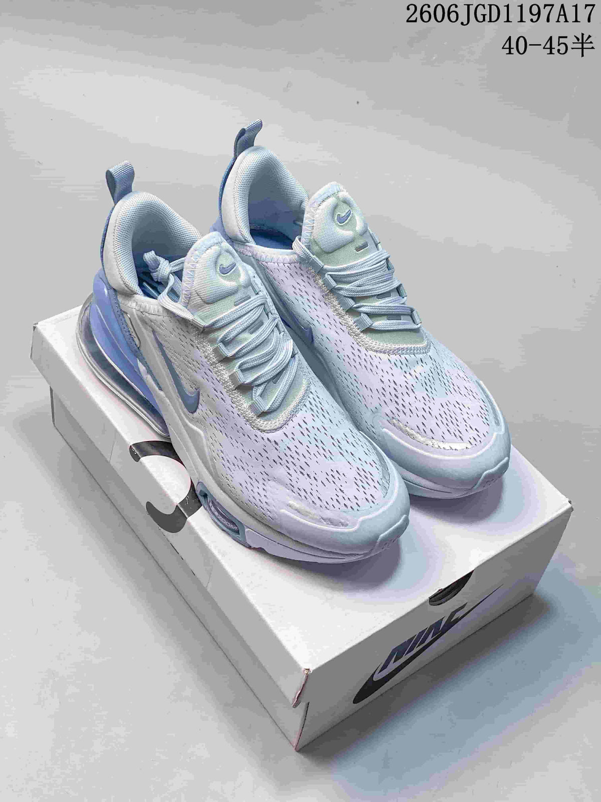 Nike Air Max Pulse shoes in white and pale blue, shown from above on a shoebox