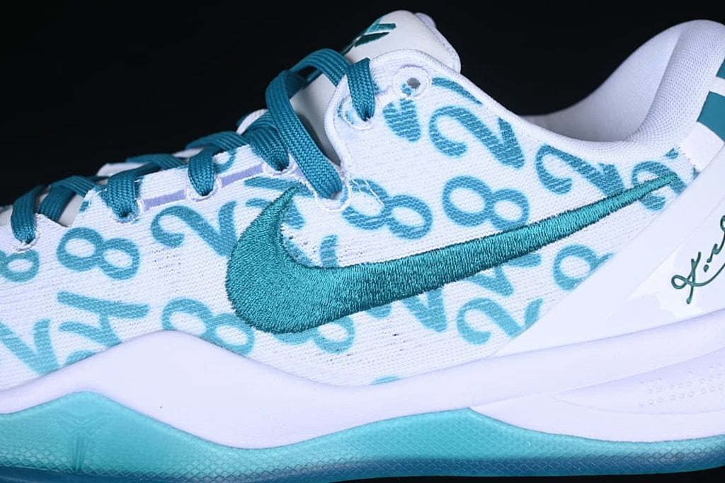Close-up of teal Swoosh and number-patterned white upper