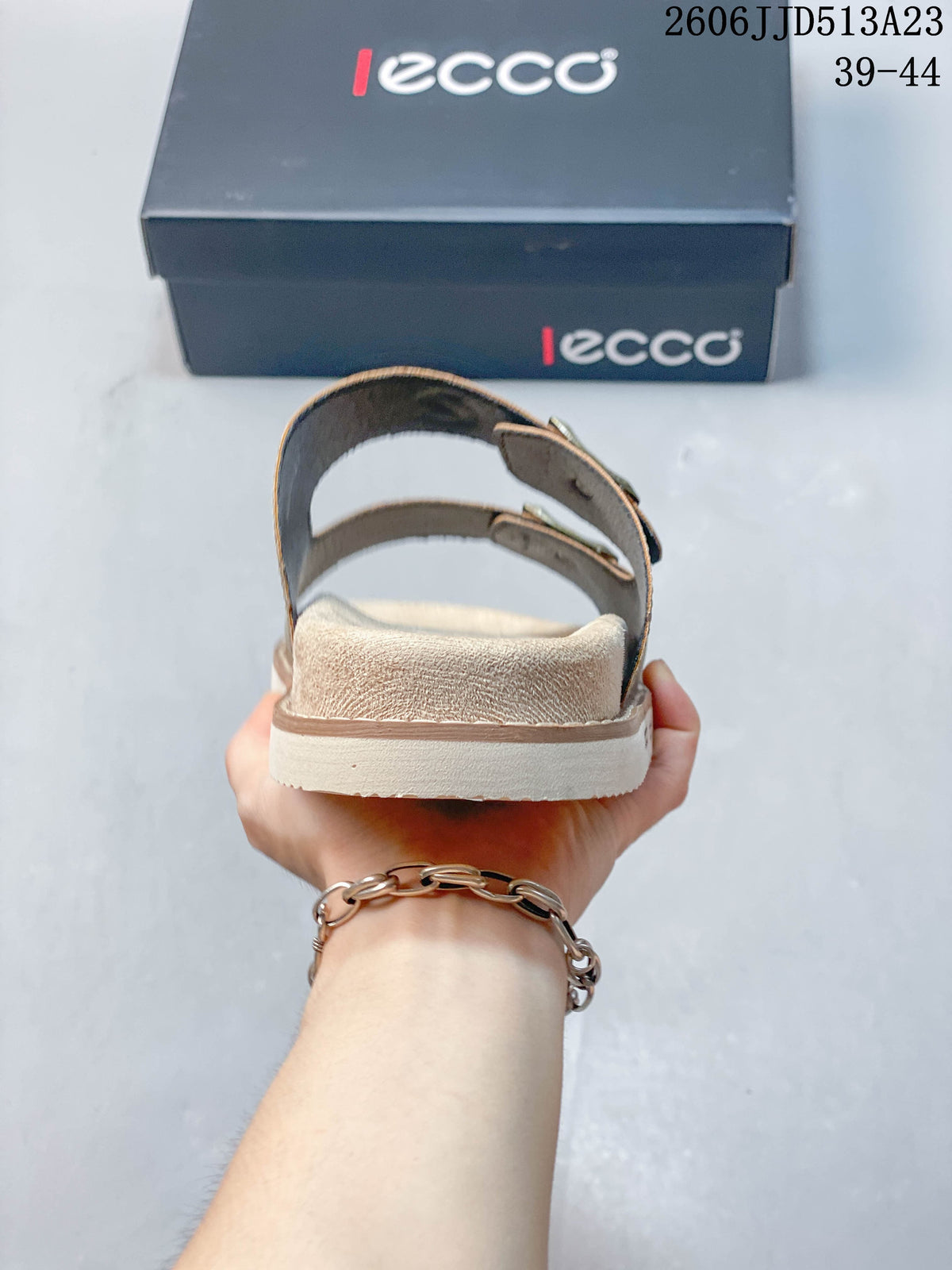 Rear view showing the sandal heel area and light-colored outsole.