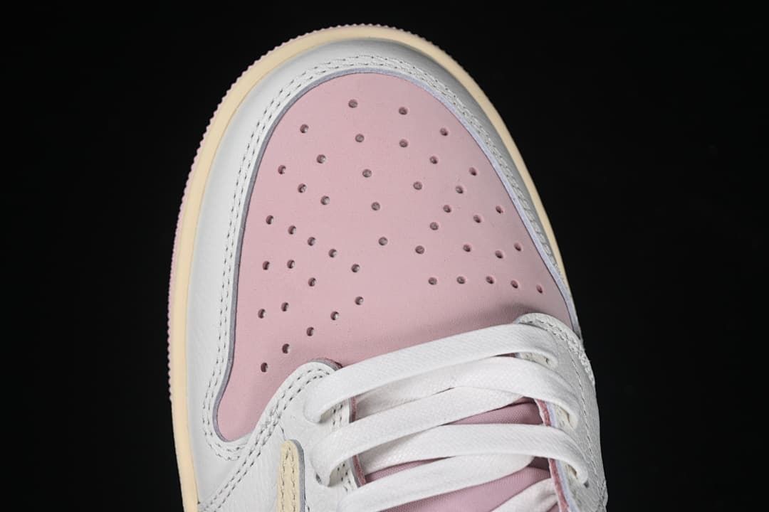 Top view of the pink perforated toe box and white laces