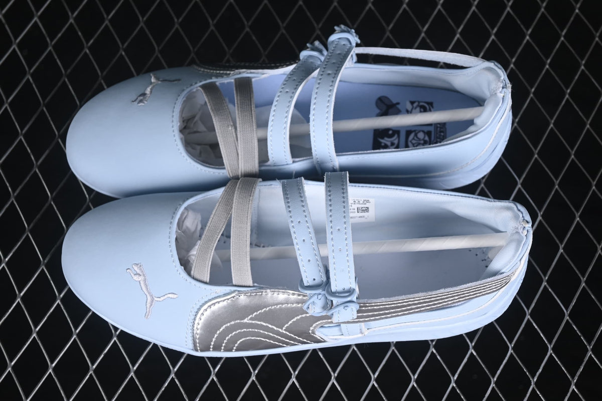 Top view of light blue Puma Speedcat Ballet sneakers with silver side detailing and multiple straps.