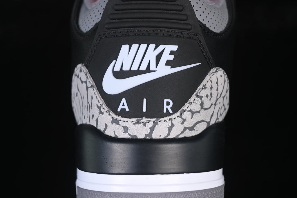 Rear close-up showing heel branding and cement-pattern heel overlays