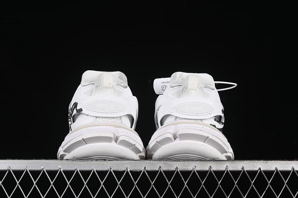 Rear view of both sneakers with heel straps and sculpted soles
