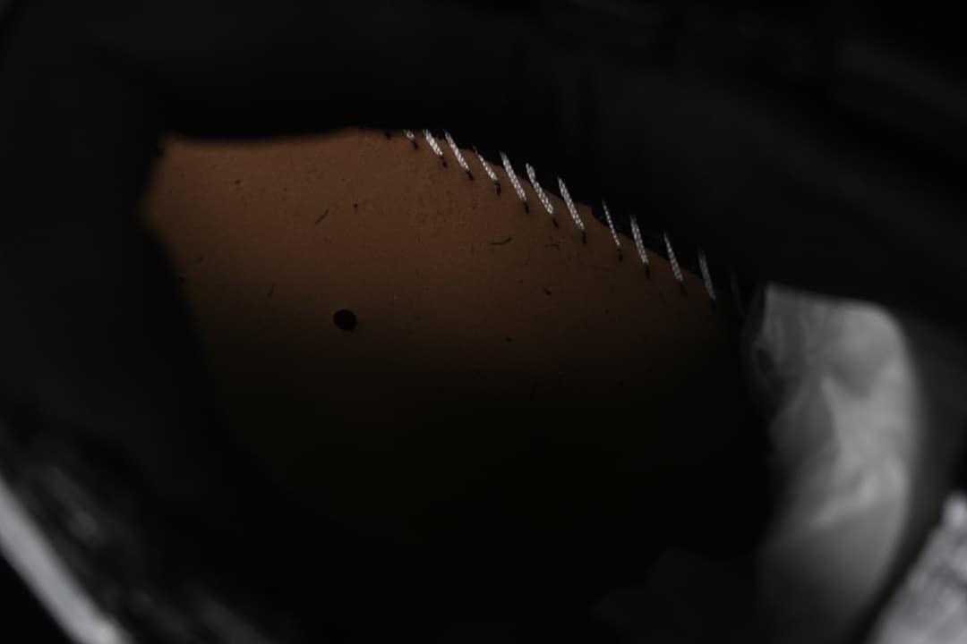 Close-up detail of stitching and the shoe interior.