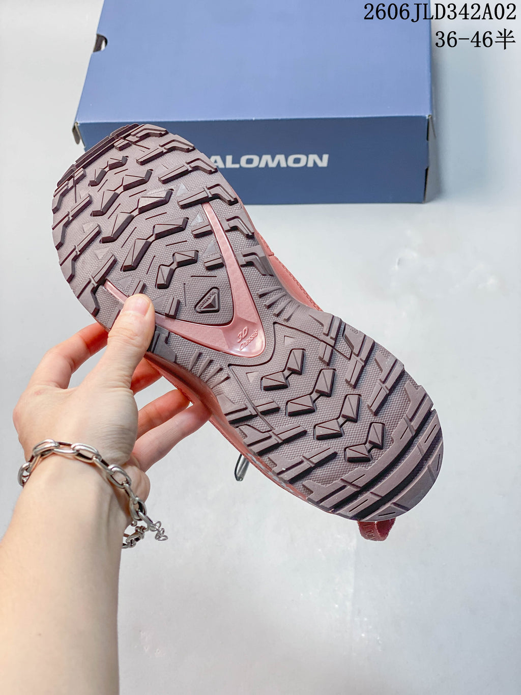Close-up of the trail shoe's lugged outsole.