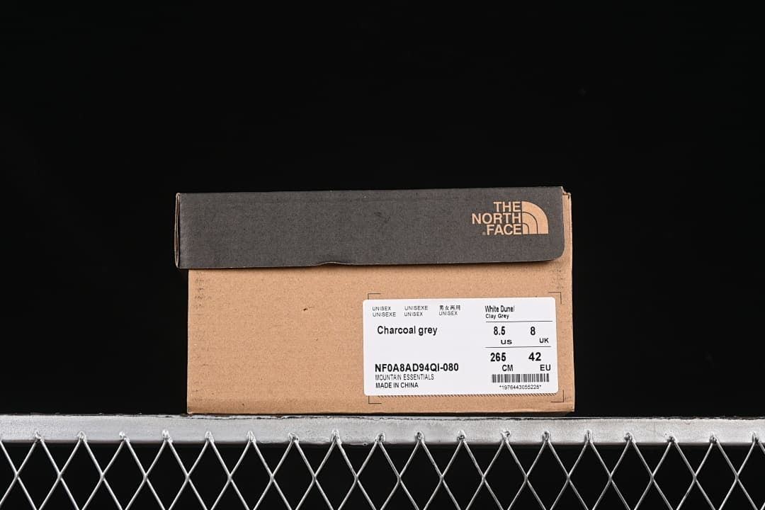 Shoebox label showing charcoal grey, style code NF0A8AD94QI-080, and sample size EU 42