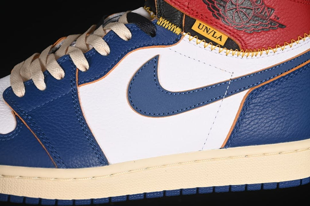 Close-up of the blue and white side panels, Swoosh, and Union label