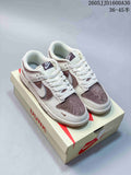 Pair of off-white and mauve-brown low-top sneakers displayed on a shoebox