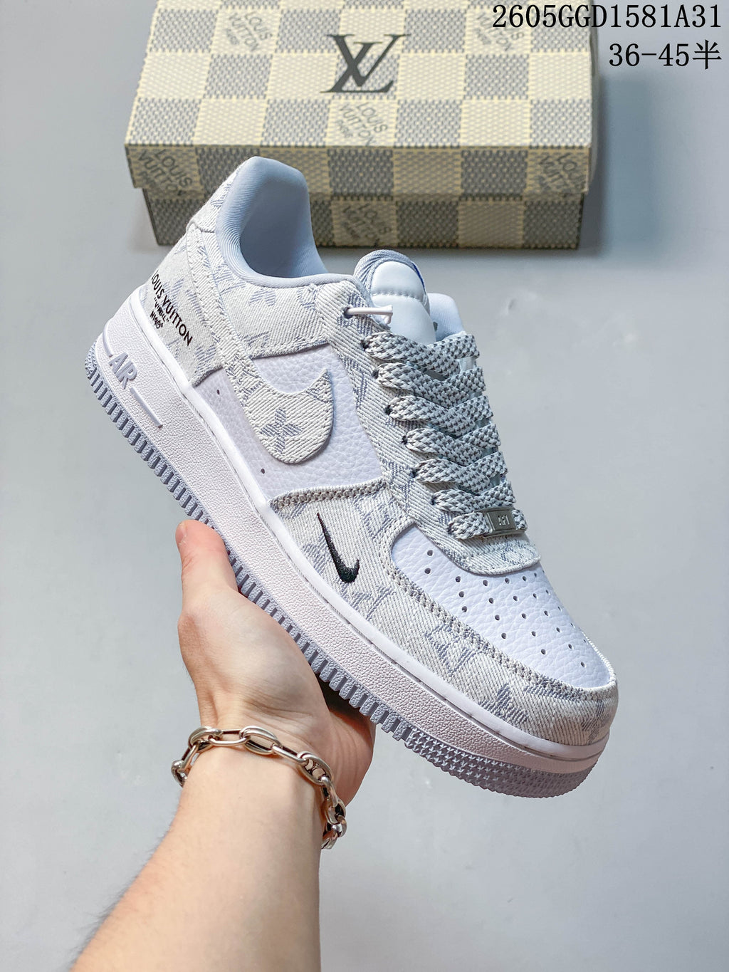Angled view of a white and grey patterned Nike low-top sneaker