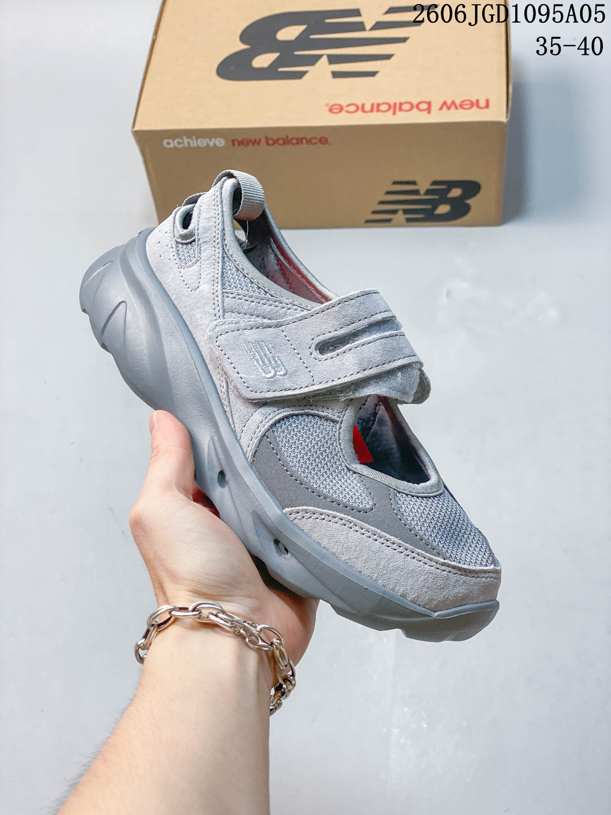 Angled side view of the gray New Balance Breeze sneaker