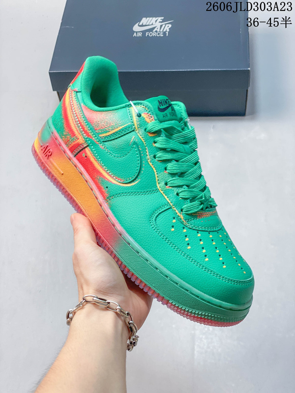 Angled side view of the green Nike Air Force 1 low-top sneaker with colorful sole accents